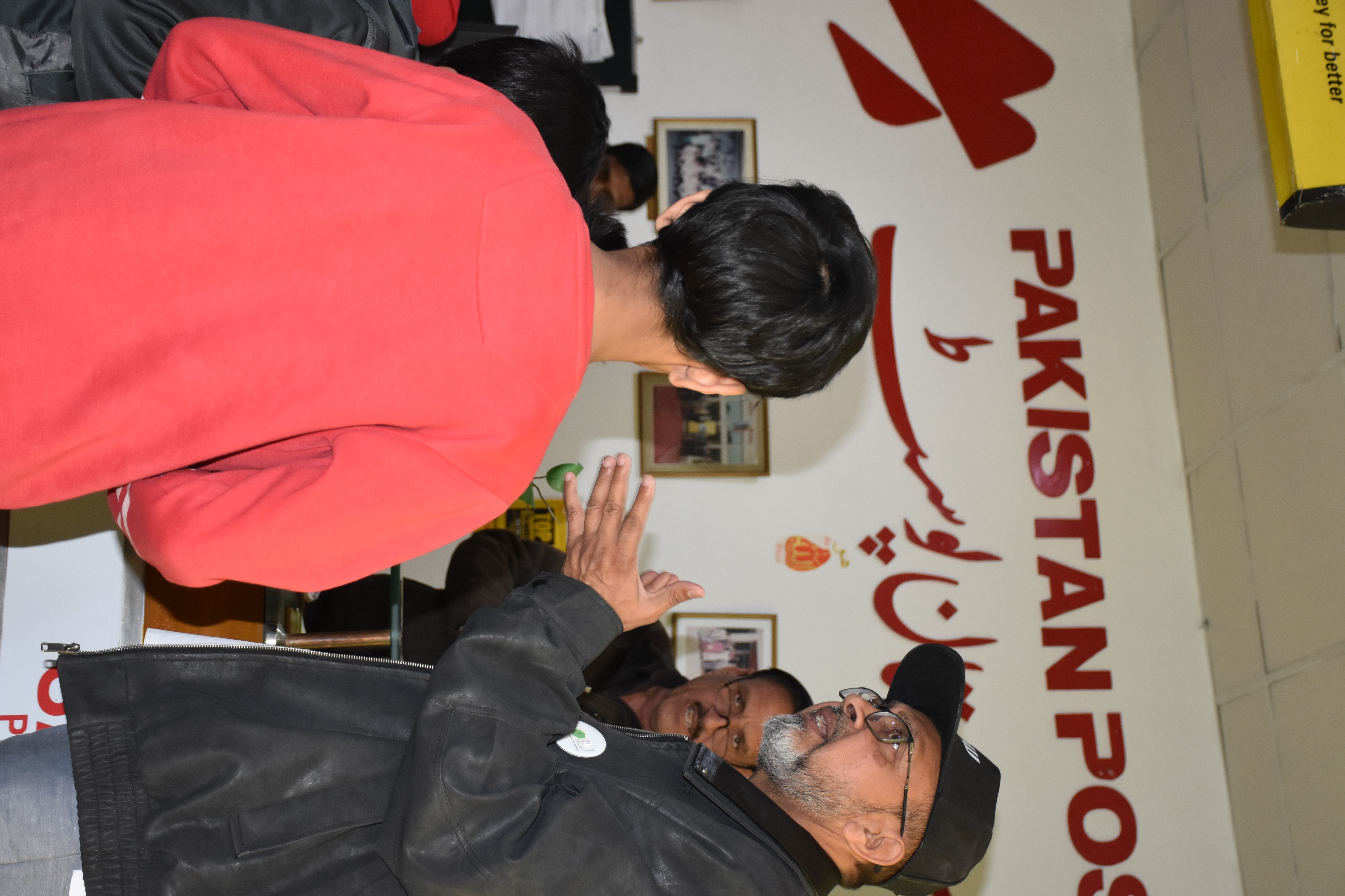 Engagement — Questions fly as the tour guide brings the post office's history to life.